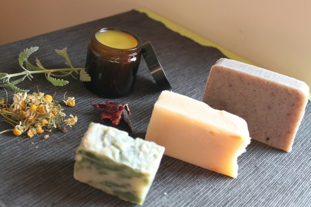 cheese and green leaves on brown wooden table